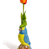 Vase en céramique avec perroquet bleu et jaune sur perchoir