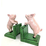 Paire de serre-livres cochons en fonte patinée