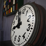 old large station clock with enamel dial