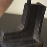 An unusual antique welder's mask on a stand