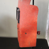 An unusual antique welder's mask on a stand