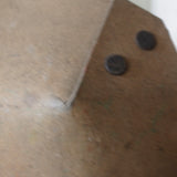 An unusual antique welder's mask on a stand