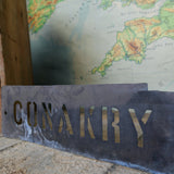 old stencil marking for museum crate transport / Conakry