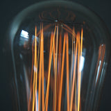 ampoule COMETTE 56  filament de carbonne facon Thomas Edison neuve