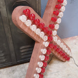 enorme lettre X d'ancienne enseigne lumineuse façon fete foraine