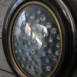 Napoleon III globe frame decorated with antique mechanical doll eyes