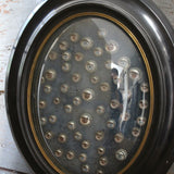 Napoleon III globe frame decorated with antique mechanical doll eyes