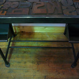Industrial desk table with printed characters on top