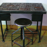 Industrial desk table with printed characters on top