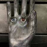 An industrial mold reimagined with doll's eyes