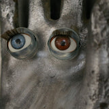 An industrial mold reimagined with doll's eyes