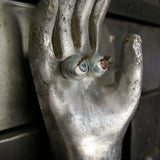 An industrial mold reimagined with doll's eyes