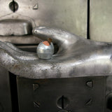 An industrial mold reimagined with doll's eyes