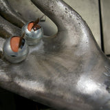 An industrial mold reimagined with doll's eyes