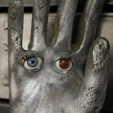 An industrial mold reimagined with doll's eyes