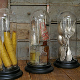 Globe decor of an old spindle and spool of thread