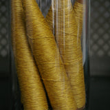 Globe decor of an old spindle and spool of thread