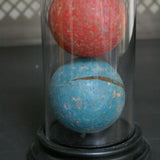 Globe decor of an antique toy/croquet set