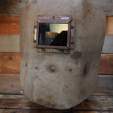 curiosité ancien masque de soudeur sur socle