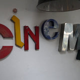 word composed of old letters, sign CINEMA
