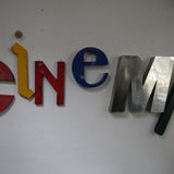 word composed of old letters, sign CINEMA
