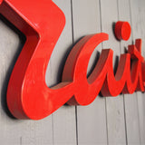 old zinc sign with the word "caterer" in bright red