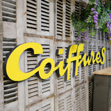 Former large metal hair salon sign