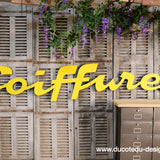 Former large metal hair salon sign