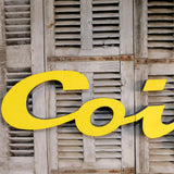 Former large metal hair salon sign