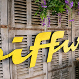 Former large metal hair salon sign