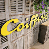 Former large metal hair salon sign