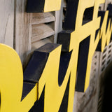 Former large metal hair salon sign