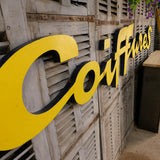 Former large metal hair salon sign