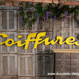 Former large metal hair salon sign