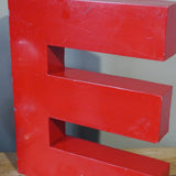 large red letter E from an old sign