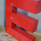 large red letter E from an old sign