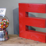 large red letter E from an old sign