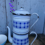 antique enameled coffee pot with blue checkered decoration