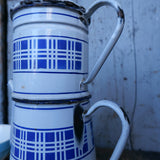 antique enameled coffee pot with blue checkered decoration