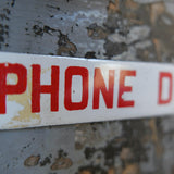 Old enamel alarm telephone sign