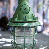Green industrial pendant lamp with glass and grid