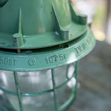 Green industrial pendant lamp with glass and grid