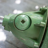 Green industrial pendant lamp with glass and grid