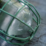 Green industrial pendant lamp with glass and grid