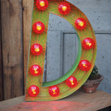 very large letter E from an old illuminated fairground sign
