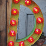 very large letter E from an old illuminated fairground sign