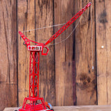 Antique toy large crane with driver