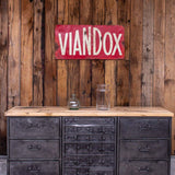 Military-style console table with metal frame, wooden top, and 26 drawers