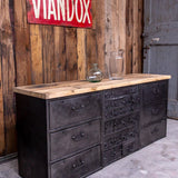 Military-style console table with metal frame, wooden top, and 26 drawers