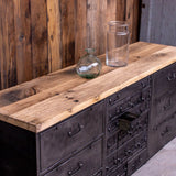 Military-style console table with metal frame, wooden top, and 26 drawers